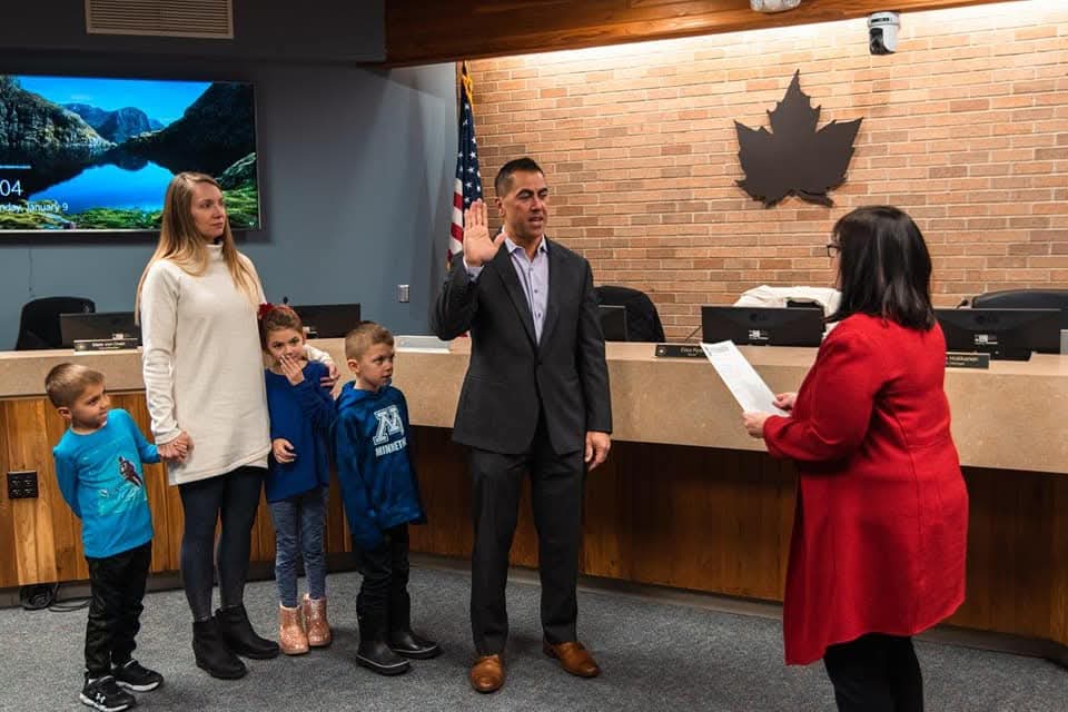 Mark von Oven being sworn in to Chanhassen City Council with his family